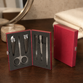 Pocket manicure set in stylish red metal case